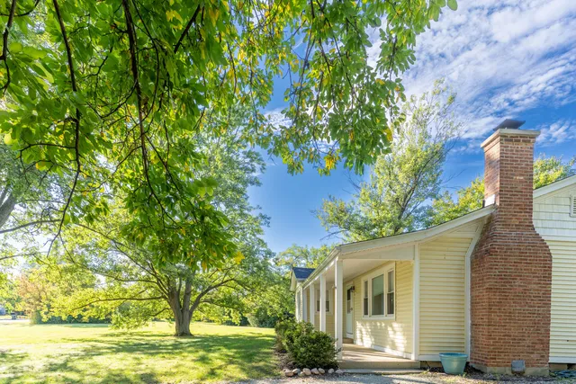 a view of yard with tree and green space