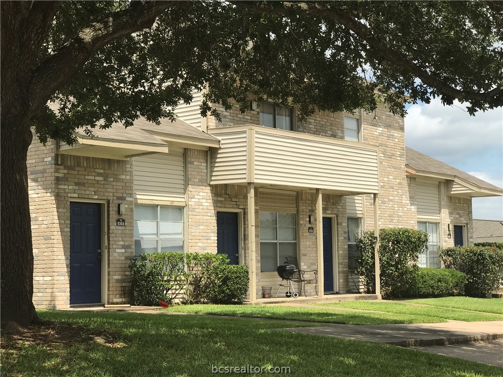 902 Spring Loop, Unit C College Station, TX 77840 - Photo 1 of 1 front view of a house with a yard