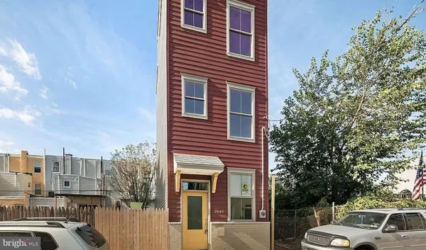 a front view of a building with parking space