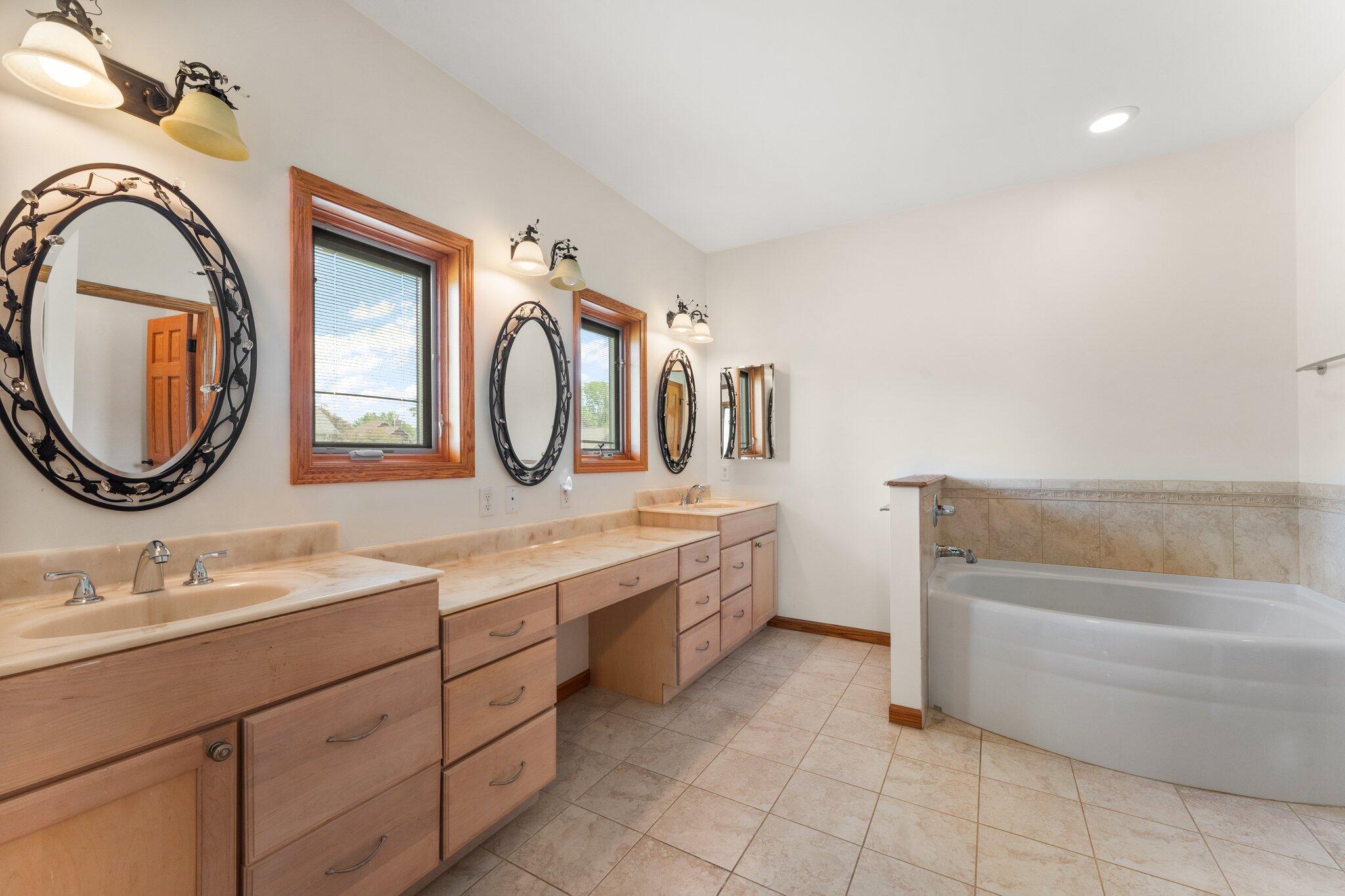 256 Pineview Lane Valparaiso, IN 46383 - Photo 11 of 18 a bathroom with a double vanity sink and a mirror