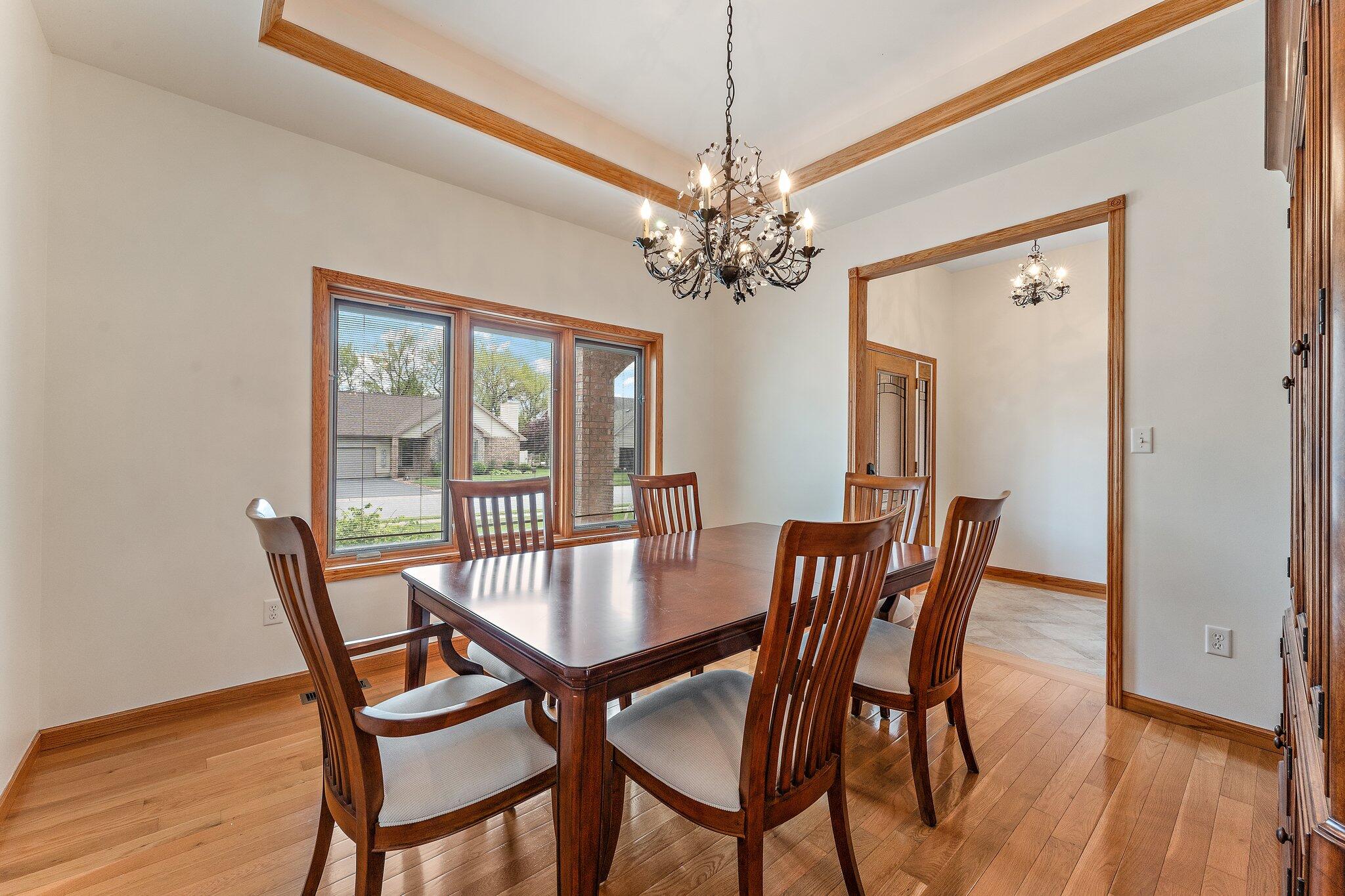 256 Pineview Lane Valparaiso, IN 46383 - Photo 3 of 18 a view of a dining room with furniture window and wooden floor