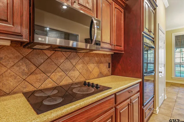 a kitchen with a sink and a stove