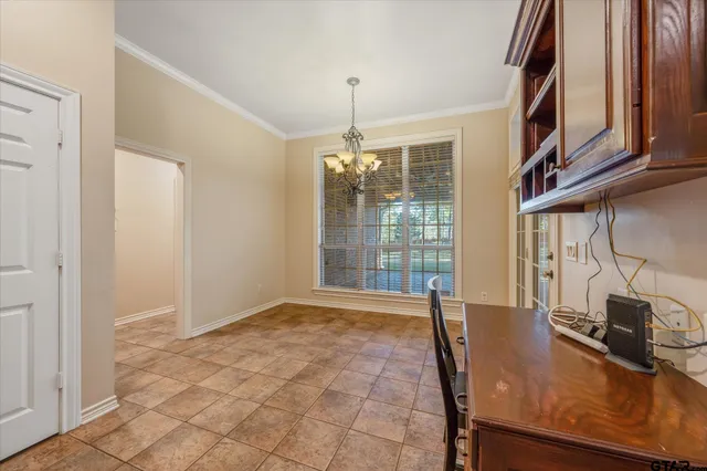 a view of an entryway with a chandelier