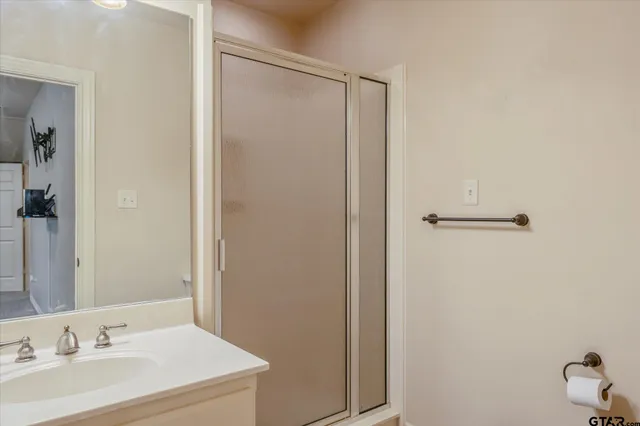 a bathroom with a sink and mirror