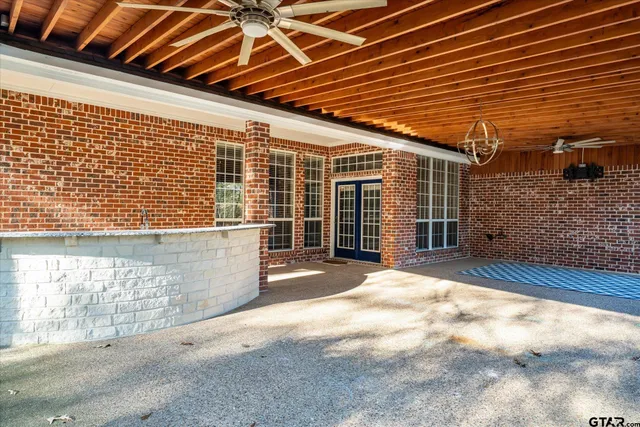 a view of a backyard with a large tree