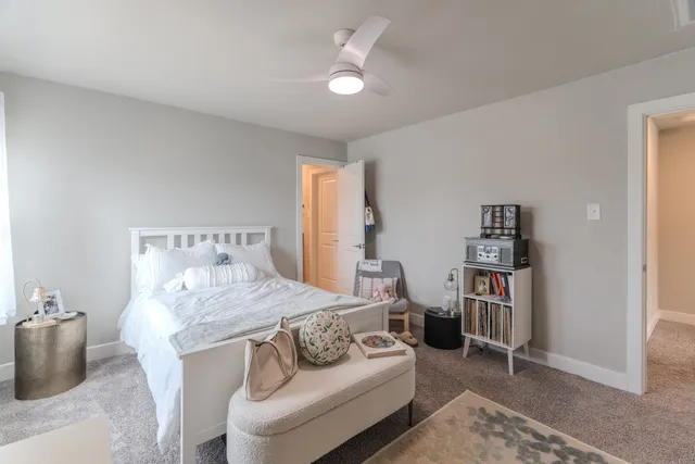 a bathroom with double vanity sinks and a mirror