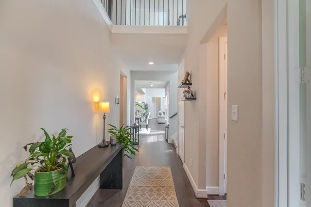 a view of a hallway with potted plants