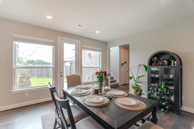 a view of a dining room with furniture window and outside view