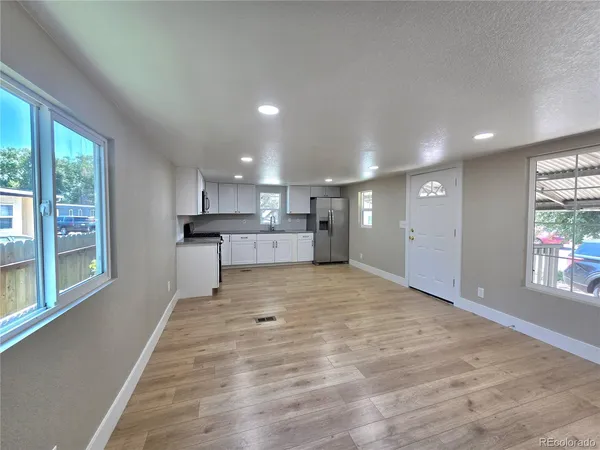 a big room with closet and windows