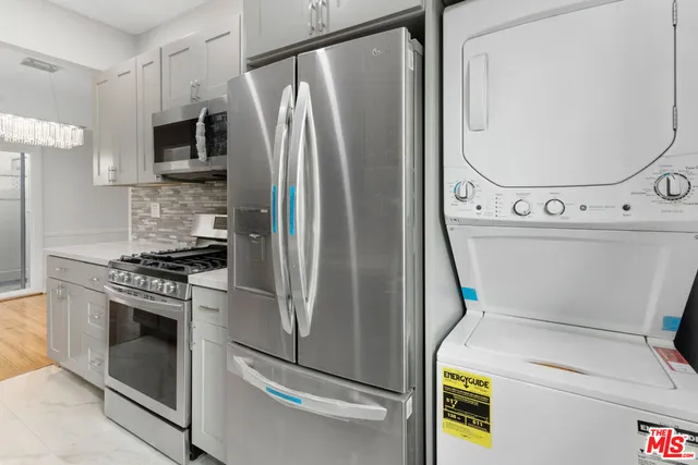 a view of a kitchen with washer and dryer
