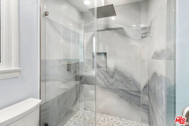 a bathroom with a shower and bathtub