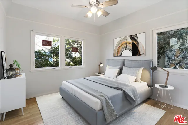 a bedroom with bed and a window