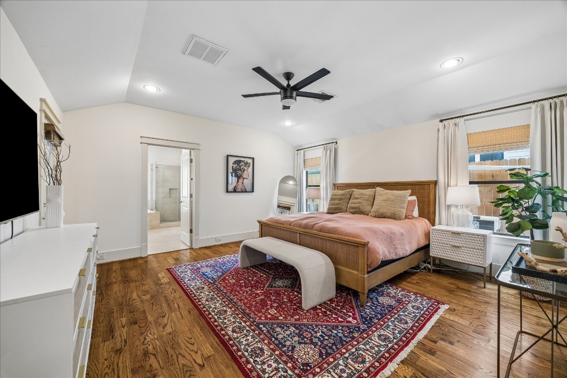1722 Lamonte Lane Houston, TX 77018 - Photo 11 of 34 a spacious bedroom with a large bed and a flat screen tv