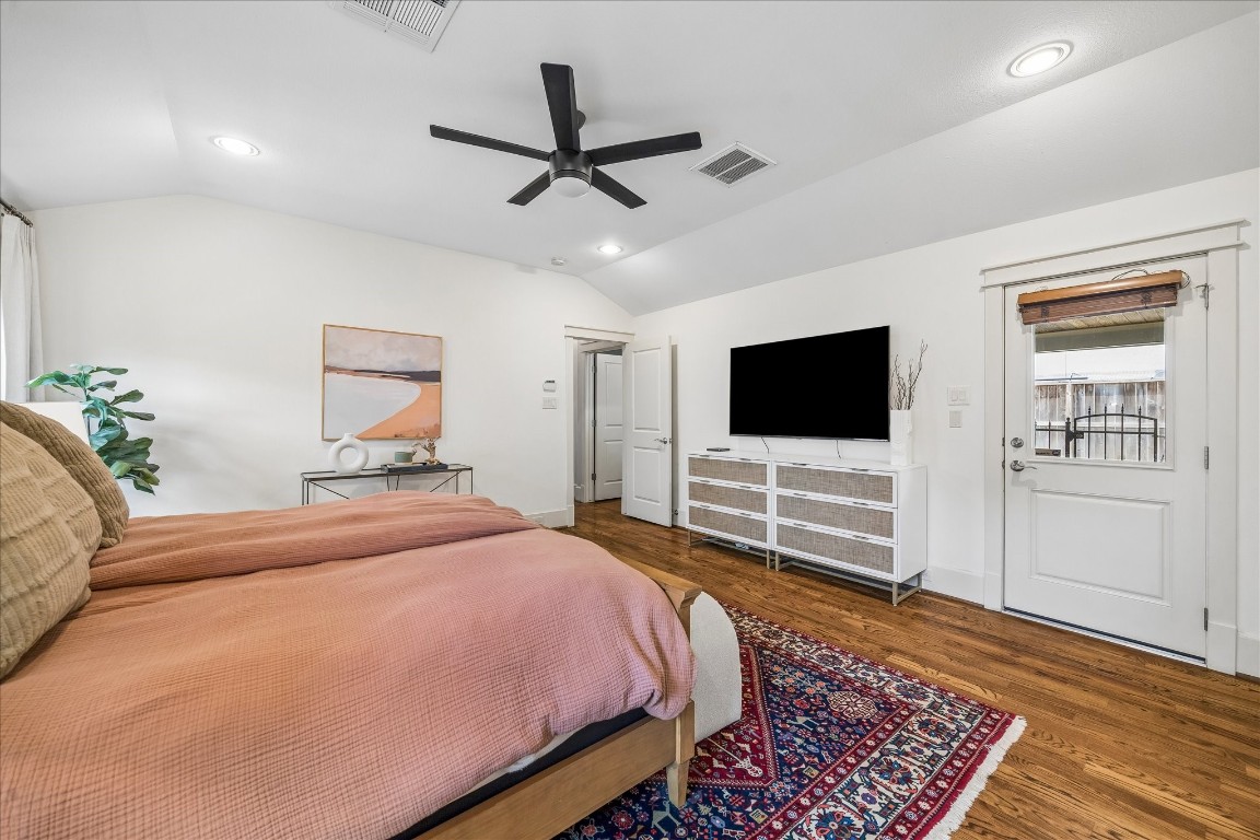 1722 Lamonte Lane Houston, TX 77018 - Photo 12 of 34 a bedroom with a bed and a flat screen tv