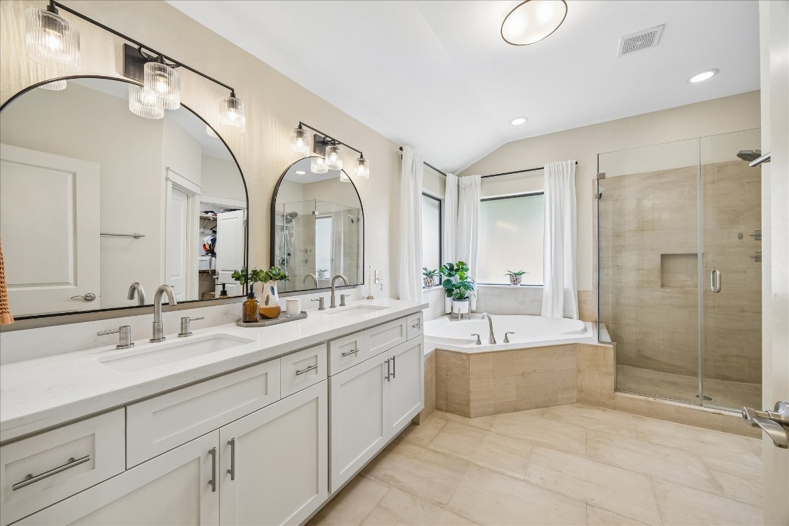 1722 Lamonte Lane Houston, TX 77018 - Photo 13 of 34 a spacious bathroom with a double vanity sink mirror double and shower