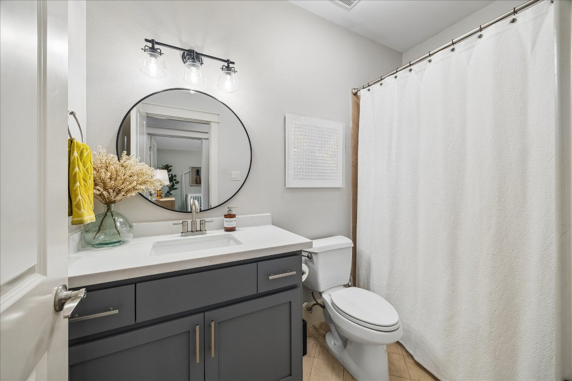 1722 Lamonte Lane Houston, TX 77018 - Photo 18 of 34 a bathroom with a sink mirror vanity and toilet