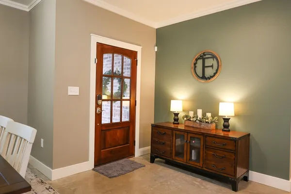 a room with a dresser and a mirror
