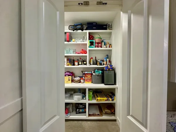 a room with toys and a book shelf