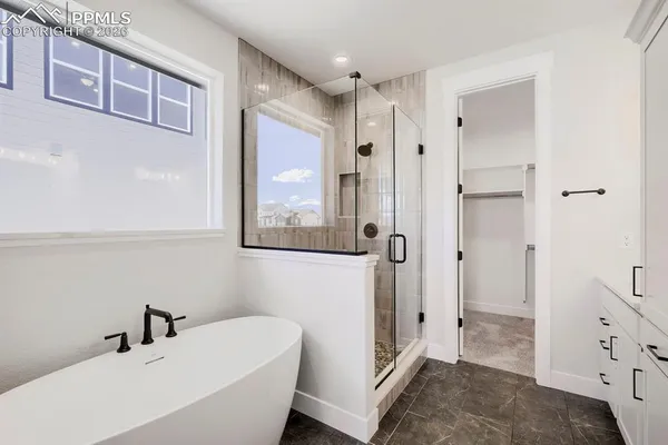a bathroom with a bathtub and a sink