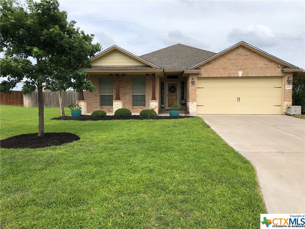 3609 Quail Ridge Drive Harker Heights, TX 76548 - Photo 1 of 1 a front view of a house with a yard and trees