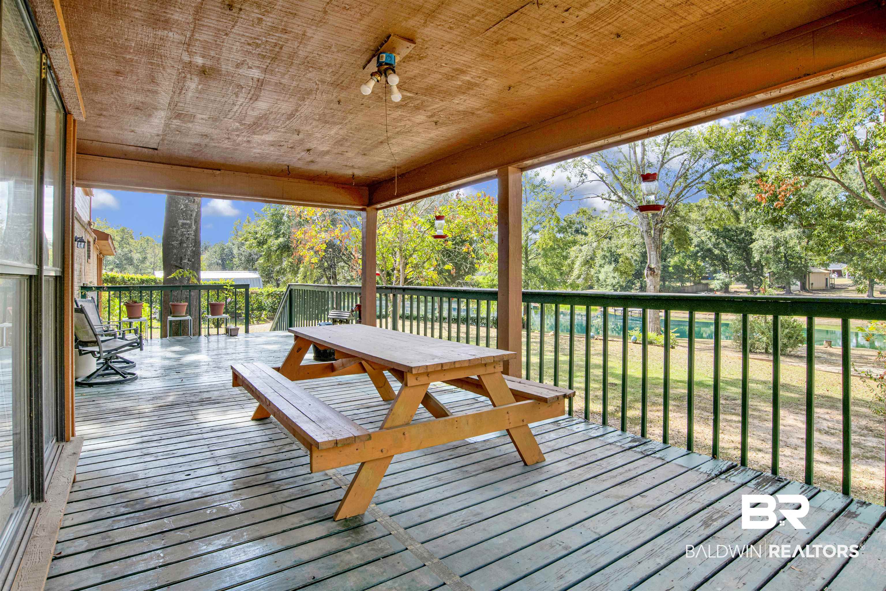 4890 Red Creek Road Semmes, AL 36575 - Photo 30 of 47 Deck with a lawn