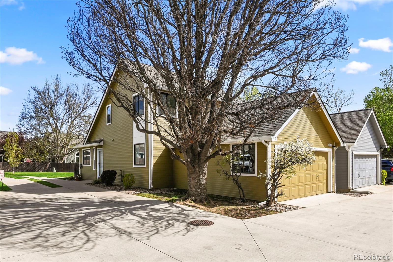 a view of a house with snow on the road