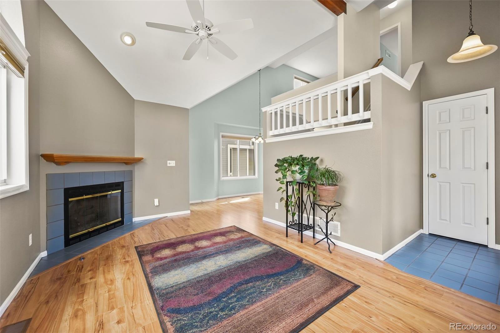 4829 Baldwin Place Boulder, CO 80301 - Photo 11 of 45 a living room with furniture and a fireplace