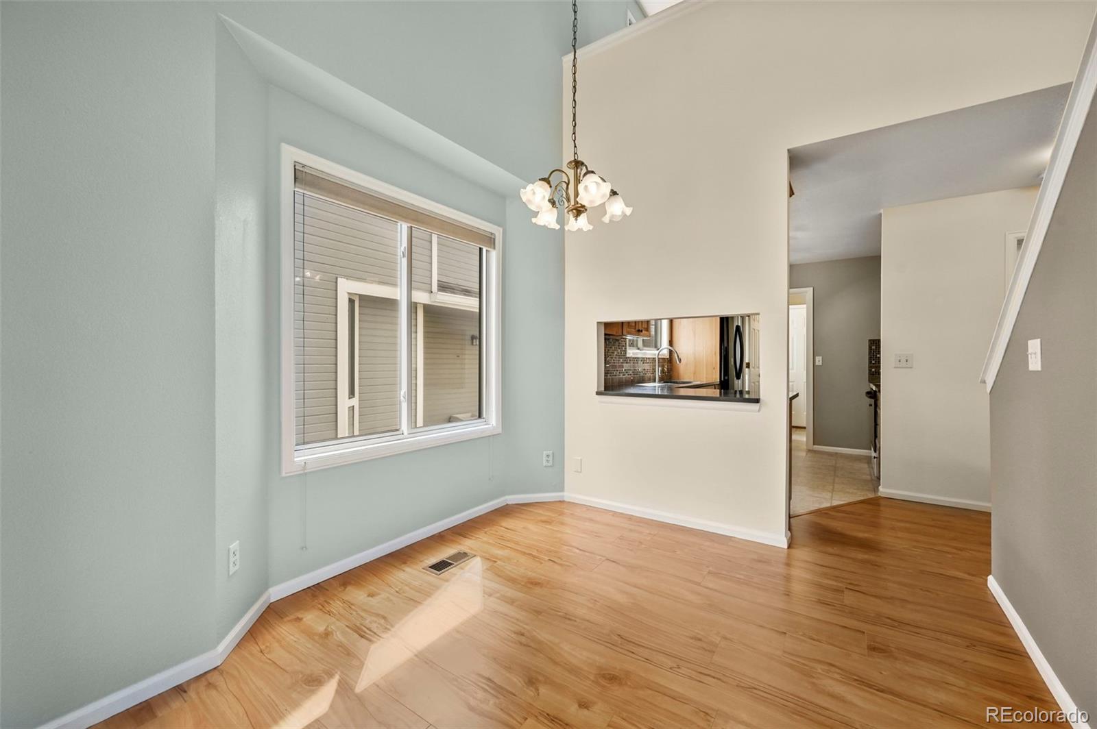 4829 Baldwin Place Boulder, CO 80301 - Photo 13 of 45 a view of an empty room with window and wooden floor
