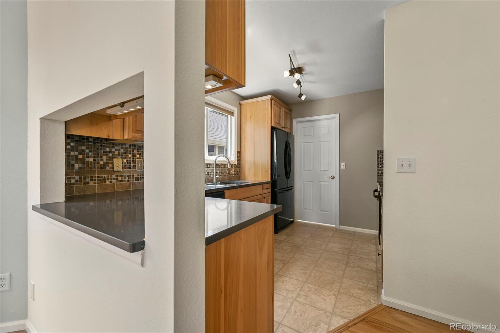 4829 Baldwin Place Boulder, CO 80301 - Photo 15 of 45 a view of a kitchen from the hallway