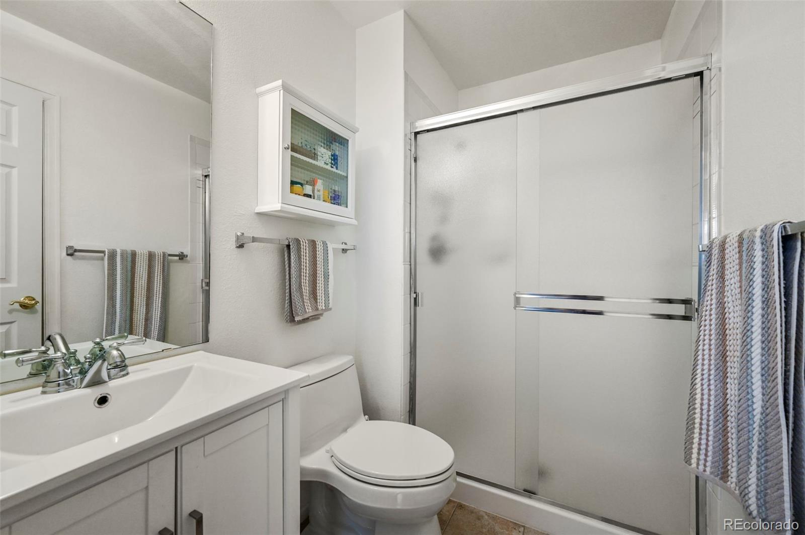 4829 Baldwin Place Boulder, CO 80301 - Photo 22 of 45 a bathroom with a sink toilet and shower