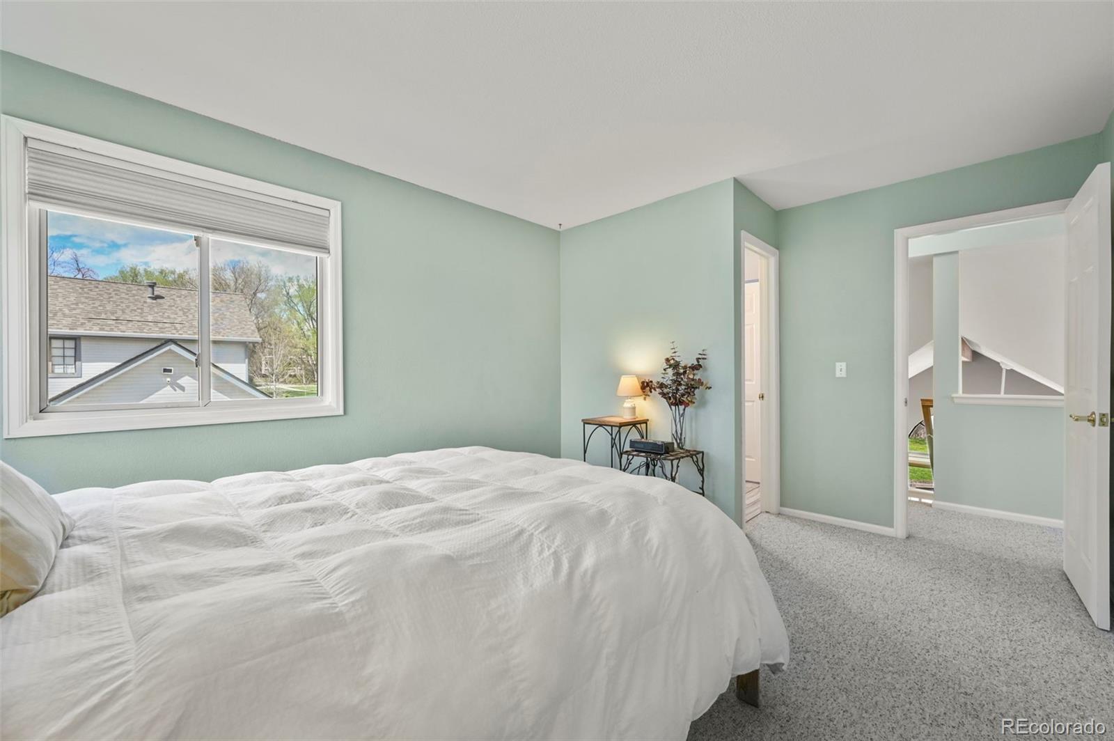 4829 Baldwin Place Boulder, CO 80301 - Photo 28 of 45 a bedroom with a bed and a painting on the wall