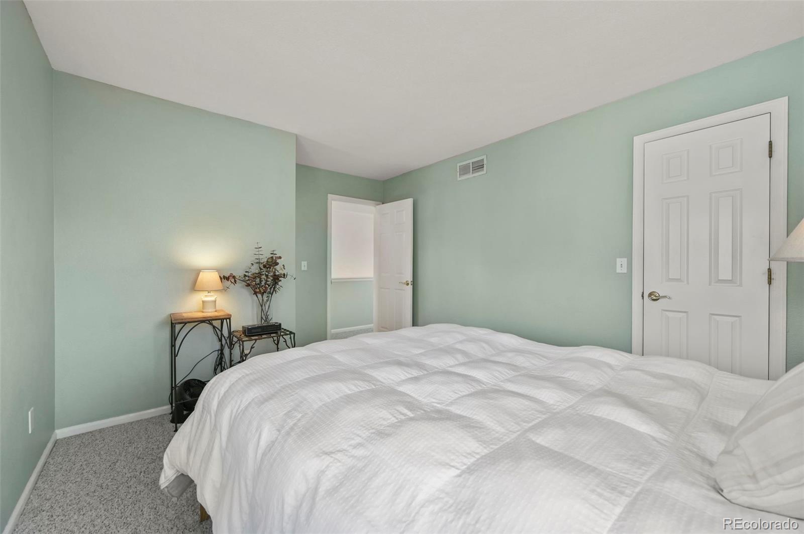 4829 Baldwin Place Boulder, CO 80301 - Photo 29 of 45 a bedroom with a bed and a table