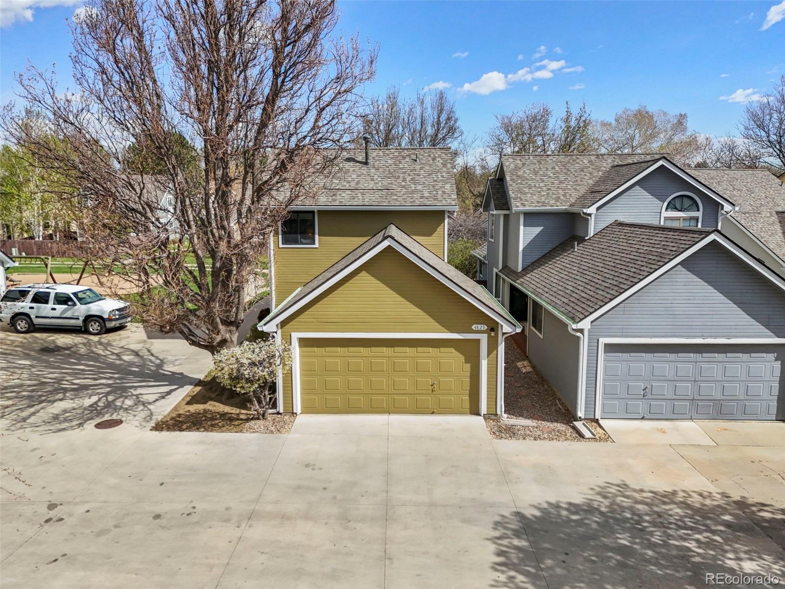 4829 Baldwin Place Boulder, CO 80301 - Photo 4 of 45 a view of a house with a yard covered in snow