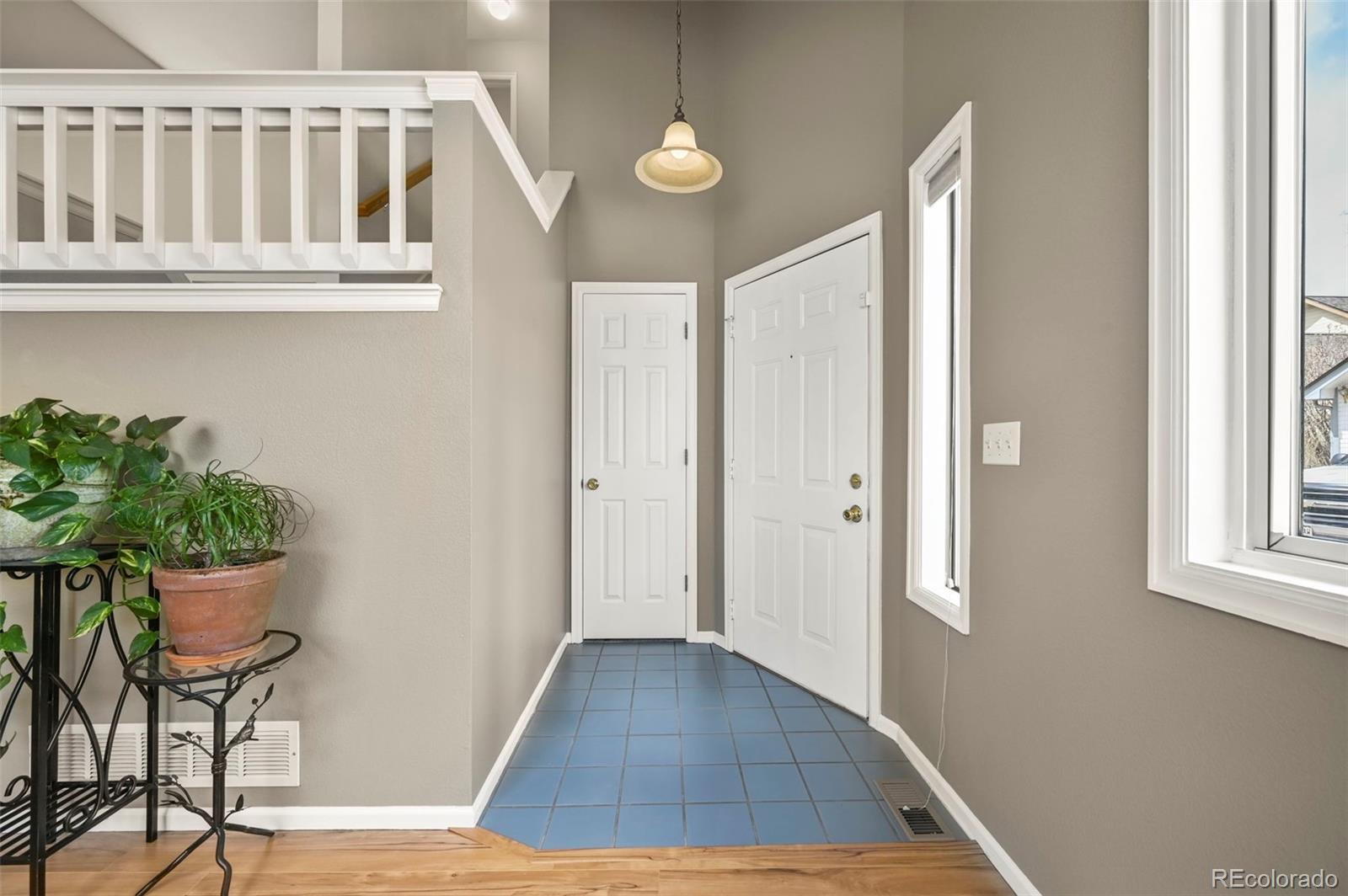 4829 Baldwin Place Boulder, CO 80301 - Photo 9 of 45 a view of a livingroom with wooden floor and chair