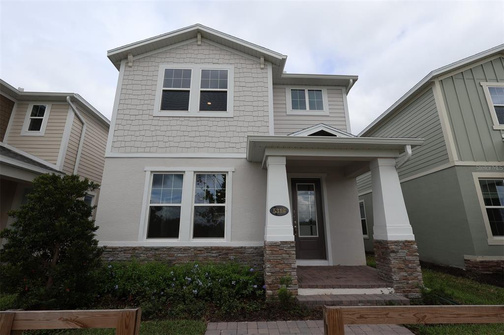 5318 Ctr Lk Rnch Boulevard St. Cloud, FL 34771 - Photo 1 of 1 a front view of a house with plants