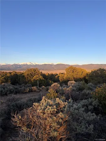 a view of a town with mountains in the background