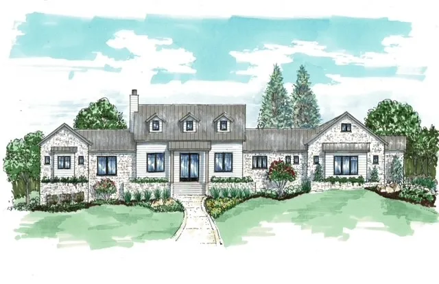 a front view of a house with a yard table and chairs