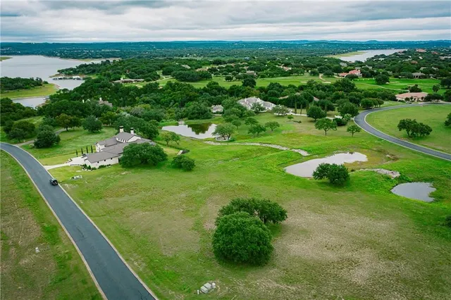 a view of a golf course with a lake