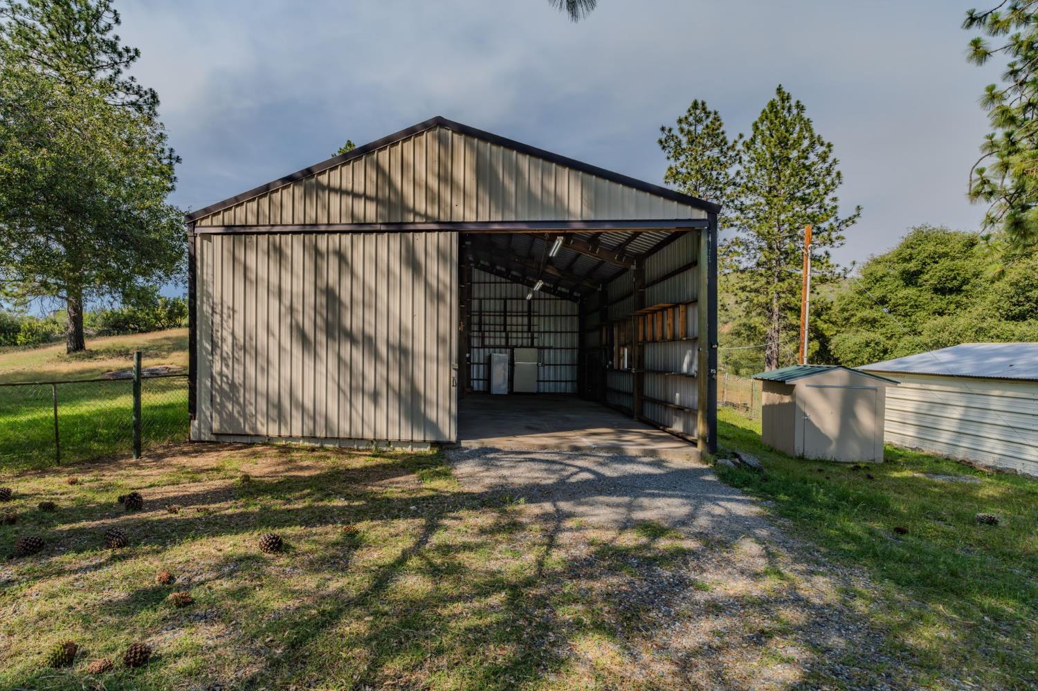 6216 Trout Lane Mountain Ranch, CA 95246 - Photo 6 of 39 a backyard of a house with lots of green space