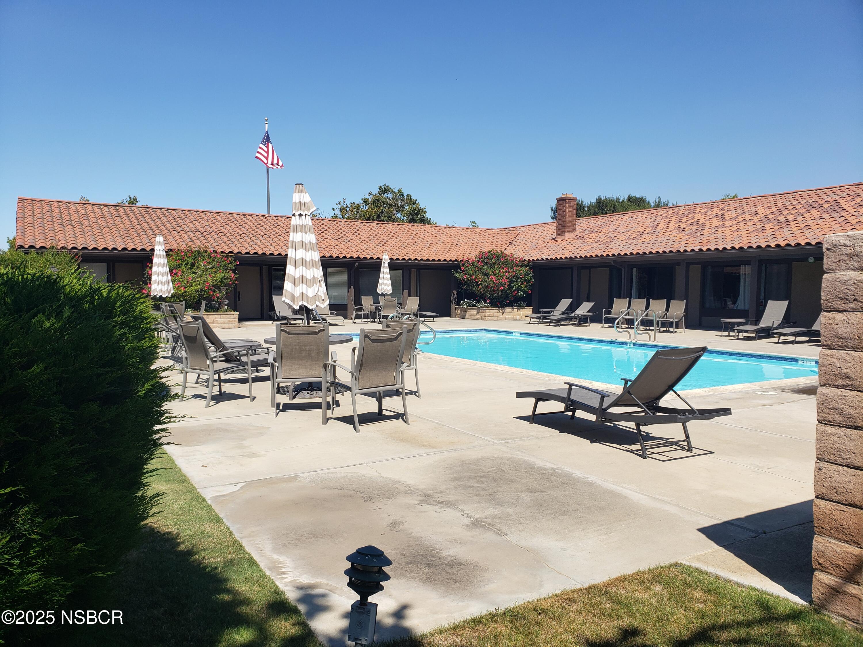 3822 Cherry Hill Road Santa Maria, CA 93455 - Photo 8 of 22 a view of a patio with a table and chairs