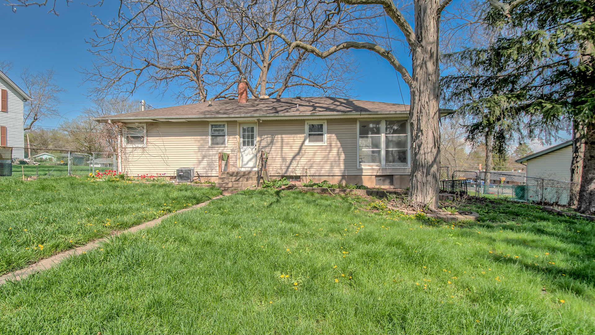 4113 West Crystal Lake Road McHenry, IL 60050 - Photo 14 of 14 a front view of a house with a yard and garage