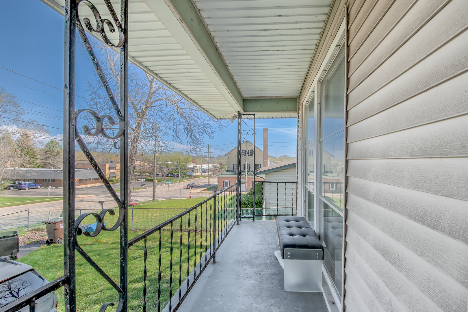 4113 West Crystal Lake Road McHenry, IL 60050 - Photo 2 of 14 a view of a porch with wooden floor and stairs