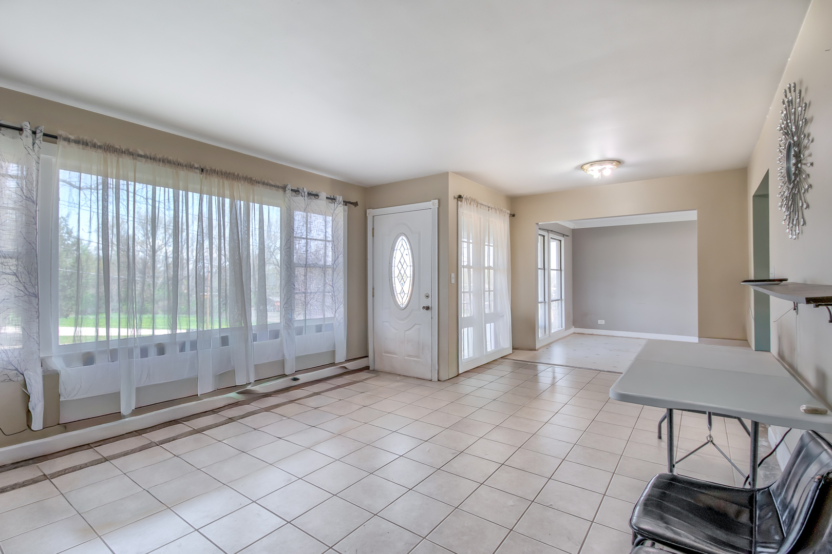 4113 West Crystal Lake Road McHenry, IL 60050 - Photo 3 of 14 a view of a livingroom with furniture wooden floor and window