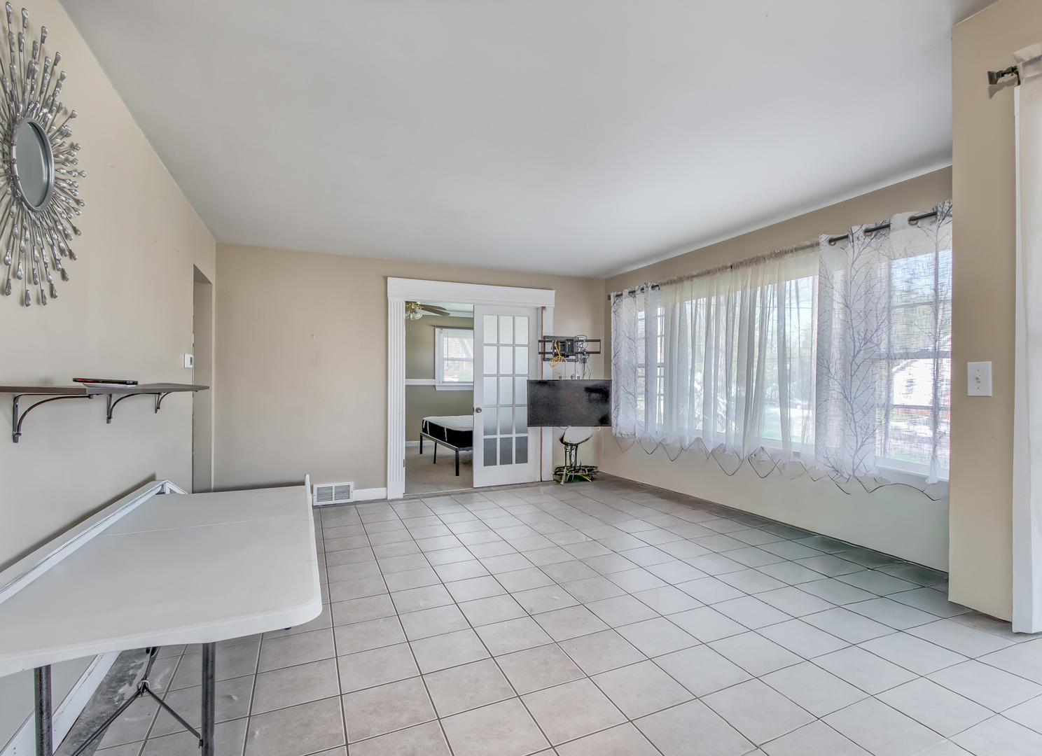 4113 West Crystal Lake Road McHenry, IL 60050 - Photo 4 of 14 an empty room with windows