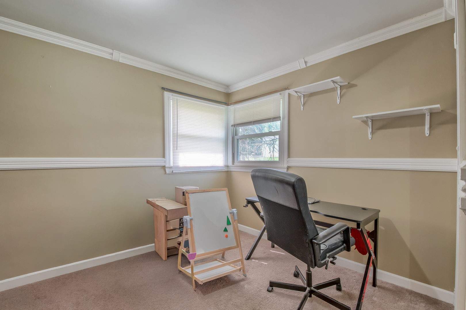 4113 West Crystal Lake Road McHenry, IL 60050 - Photo 10 of 14 a view of a workspace with furniture and a window