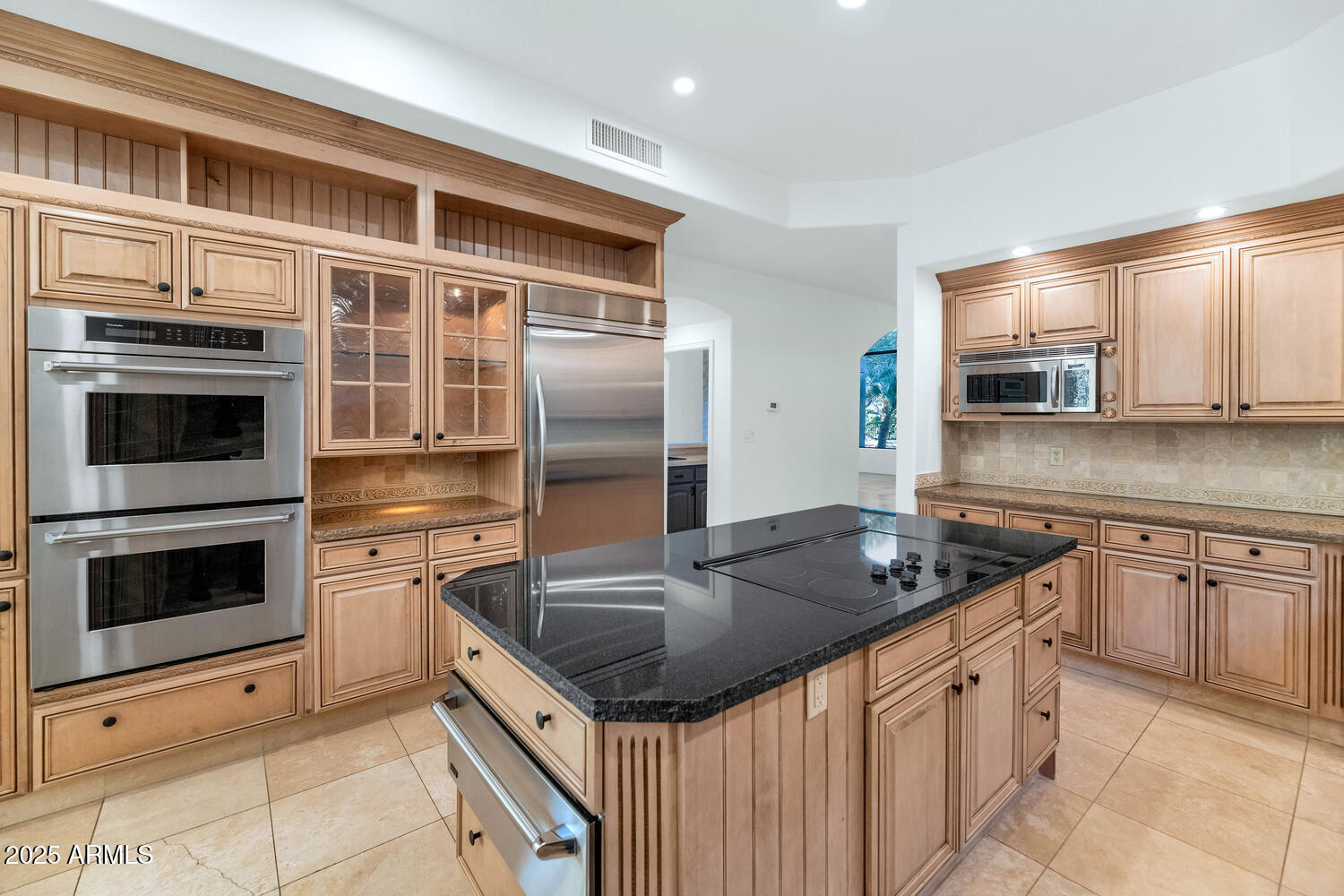 7878 East Gainey Ranch Road, Unit 25 Scottsdale, AZ 85258 - Photo 13 of 42 a kitchen with stainless steel appliances granite countertop a sink stove and microwave