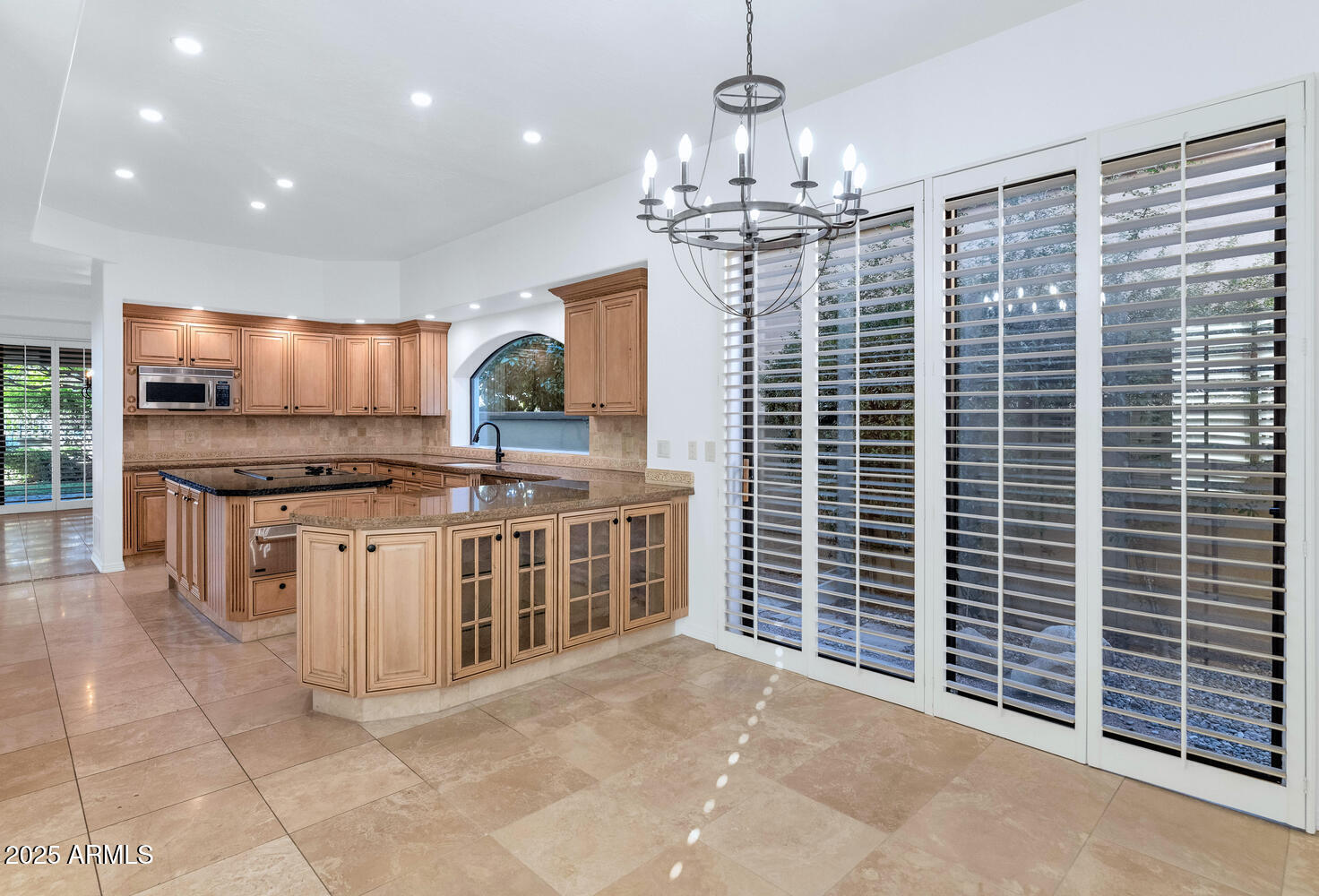 7878 East Gainey Ranch Road, Unit 25 Scottsdale, AZ 85258 - Photo 14 of 42 a view of kitchen with granite countertop stove top oven and cabinets
