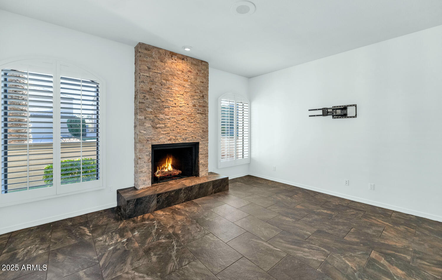 7878 East Gainey Ranch Road, Unit 25 Scottsdale, AZ 85258 - Photo 17 of 42 a view of a livingroom with a fireplace and window