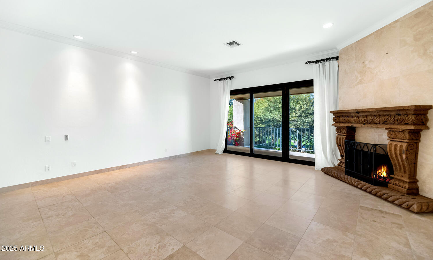 7878 East Gainey Ranch Road, Unit 25 Scottsdale, AZ 85258 - Photo 21 of 42 an empty room with windows and fireplace