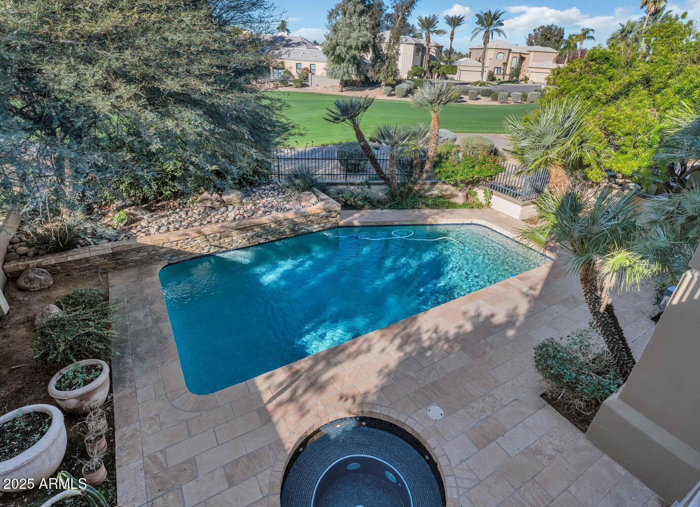7878 East Gainey Ranch Road, Unit 25 Scottsdale, AZ 85258 - Photo 23 of 42 a view of a garden with a fountain